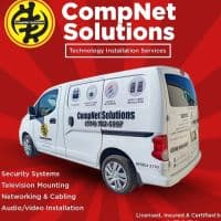 White CompNet Solutions service van advertising technology installation services against a red sunburst background.